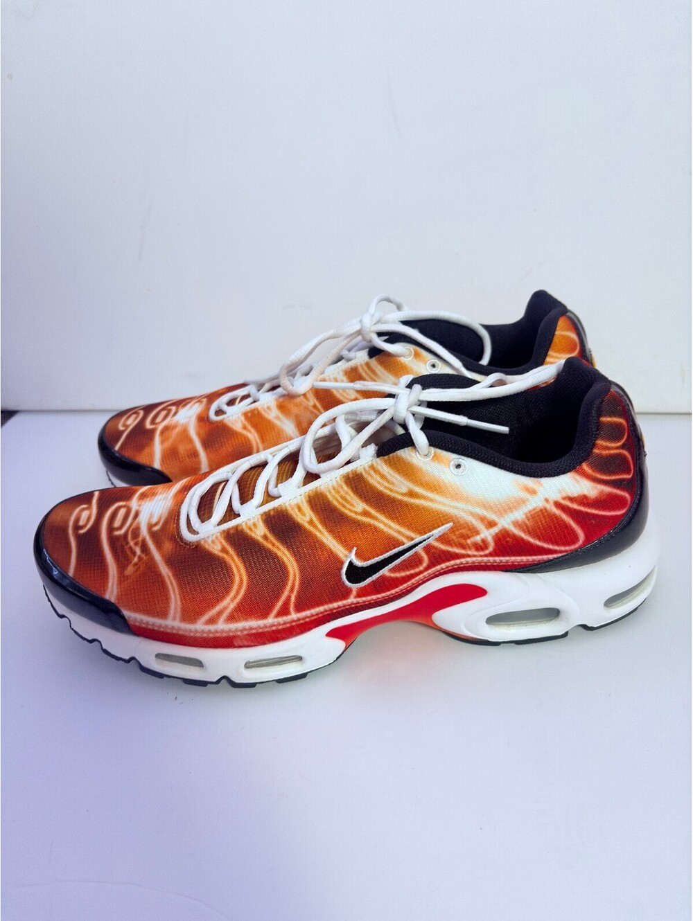 Nike Air Max Plus orange flame print sneakers